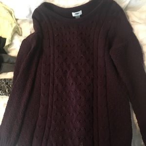 A dark purple sweater